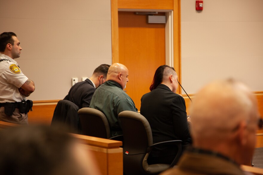 Jason Carroll, center, who says he was wrongfully convicted of the 1988 murder of Sharon Johnson, appeared in Hillsborough Superior Court North in Manchester on Wednesday, Nov. 16, 2022.