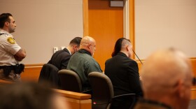 Jason Carroll, center, who says he was wrongfully convicted of the 1988 murder of Sharon Johnson, appeared in Hillsborough Superior Court North in Manchester on Wednesday, Nov. 16, 2022.