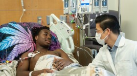 As his stem cells are collected, DeShawn “DJ” Chow talks about his upcoming sickle cell gene therapy treatment with pediatric hematologist-oncologist Leo Wang at City of Hope Children’s Cancer Center on May 22. 