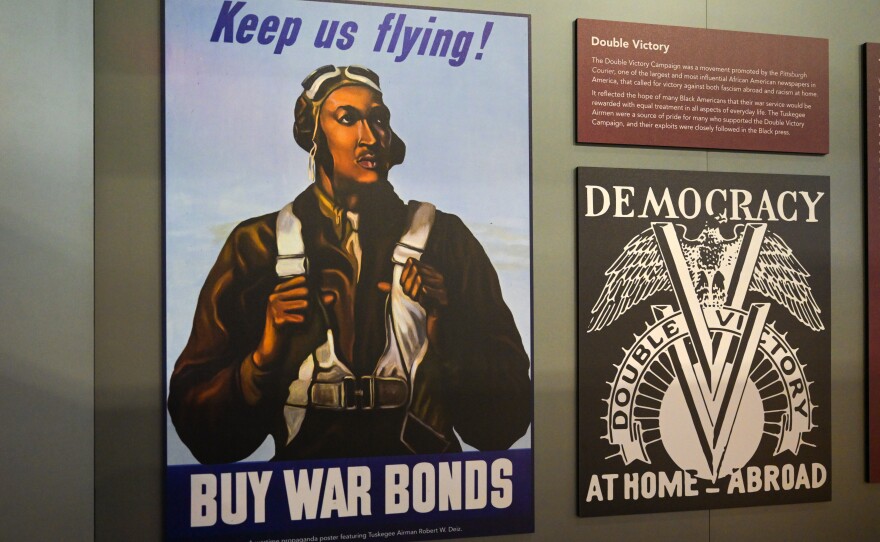 A wartime propaganda poster featuring Tuskegee Airman Robert W. Deiz at the New England Air Museum. September 3, 2024.