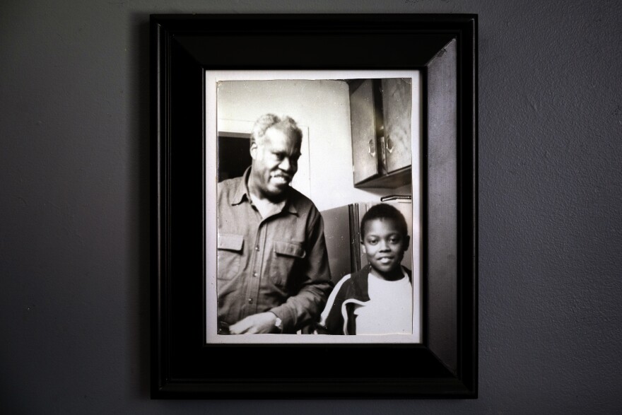 A photograph Lt. Col. Bertram W. Wilson (left) and her son Cheo Hodari Coker when he was 9 years old hangs in the home of Wilson's daughter and Coker's mother, Connecticut State Representative Pat Wilson Pheanious.