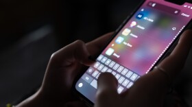 A teenager uses her mobile phone to access social media on Jan. 31, 2024, in New York City. The city may soon become the largest school district in the nation to ban cellphones for students. 