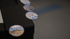 “I voted” stickers line the edge of a ballot box at the Keene Ward 1 polling place on Tuesday, Jan. 23, 2023, in Keene, N.H. (Raquel C. Zaldívar/New England News Collaborative)