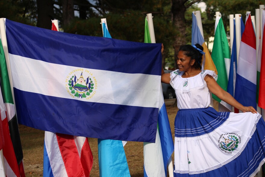 Glenda Davis of El Salvador shows off her country's flag at the Concord Multicultural Festival on Sunday, Sept. 22, 2024.