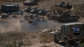 Tanks and troops gather in northern Israel on Monday in preparation for a ground invasion.