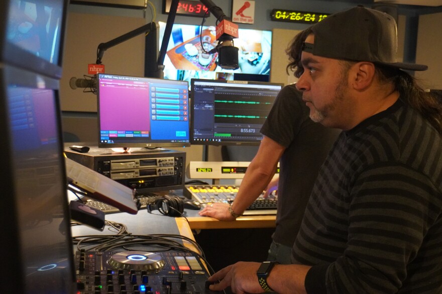 DJ K-Low sets up in NHPR's master control room along side NHPR's Rick Ganley