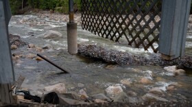 Parts of Gorham resident Alex Roberts’s home are suspended over the Peabody River.