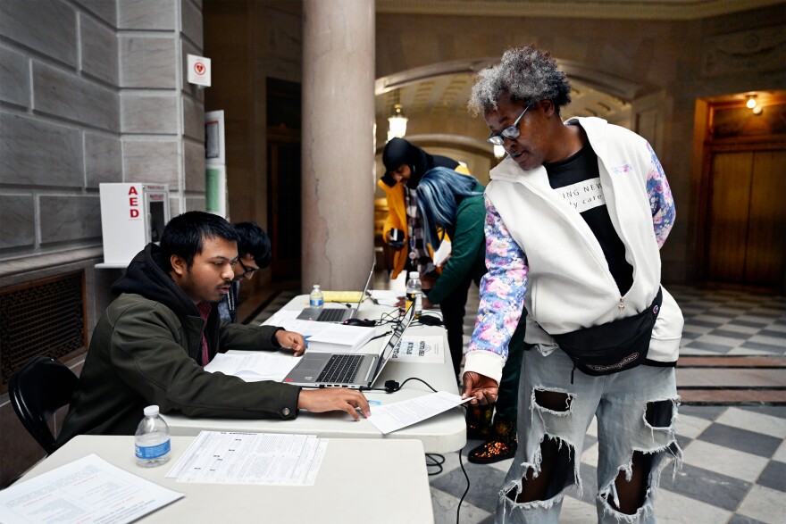 Martina Gordon, who is homeless, registers to vote on the morning of Election Day 2023 at Hartford City Hall. The last time she voted was in the 1992 Presidential Election. Hartford, Connecticut - November 7, 2023.