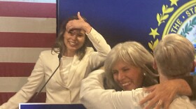 Maggie Goodlander looks on as her mother, Betty Tamposi, hugs a supporter at Goodlander's primary night victory party in Nashua, Sept. 10, 2024,