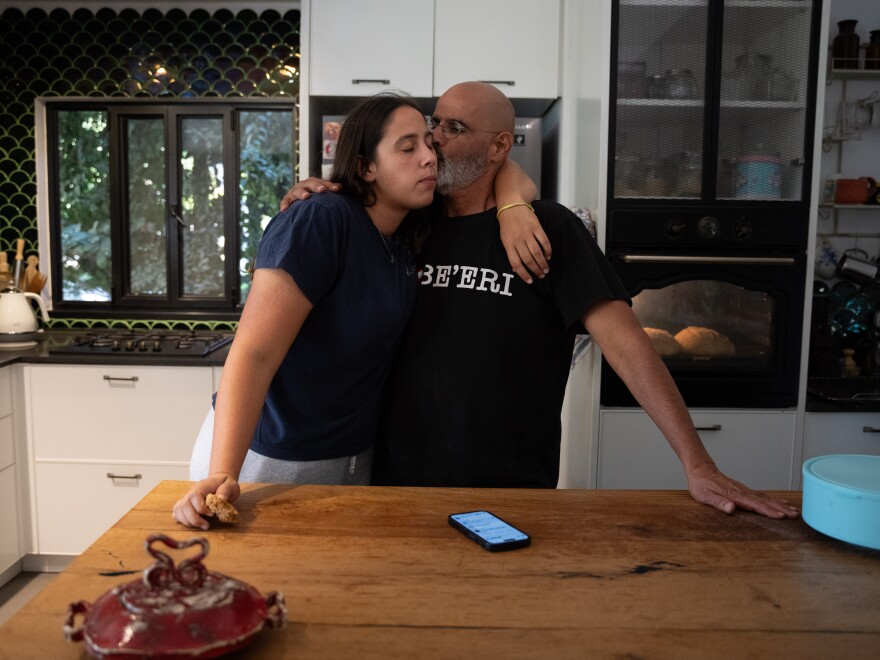 Gal Cohen, the head of Kibbutz Be’eri, stands with his daughter Mia, 22, in their home close to the border with Gaza. They survived the Oct. 7 attack locked in their home’s safe room. Cohen’s goal is to rehabilitate the kibbutz and bring all the survivors back within two and a half years.