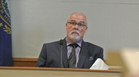 Earl Gage testifies at Merrimack County Superior Court in Concord, N.H. on Aug. 28, 2024 in the trial of Victor Malavet. Gage was a police officer who investigated claims of an inappropriate relationship between Malavet and a 16-year-old girl incarcerated at the youth detention facility where Malavet worked. What escaped scrutiny — or even mention — during the trial was that Gage is also accused repeatedly raping a child when he worked overtime at another youth detention center.