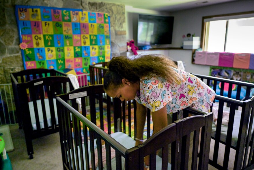 FILE: Nichelle Waddell, owner of Watch Me Grow Daycare takes care of 12 children with four staff members in her home. Waddell is a strong supporter of a bill signed by Governor Lamont in June aimed at helping address a shortage of childcare providers.