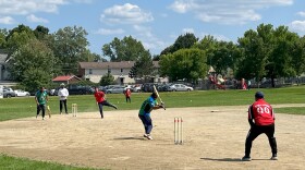 A player from Manchester's Murraa Brothers pitches to a Boston All Stars batter during a cricket tournament Saturday at Manchester's Prout Park.