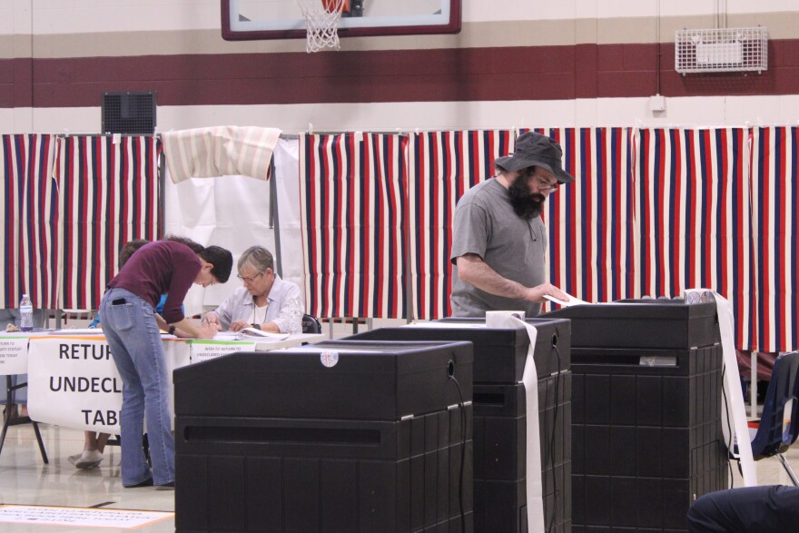 People cast ballots in a polling place