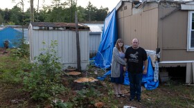 Jessica and Nathan Taylor’s home was red tagged, deeming it unsafe to live in, following a July storm that devastated the cooperative. The couple visited their home to gather more of their belongings after a board meeting Thursday evening, August 8.