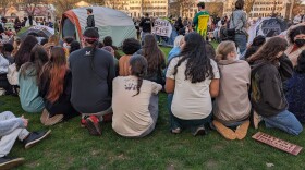 Protesters gather on the Dartmouth Green in Hanover on the evening of May 1, before being dispersed and — in some cases — arrested by state and local police.