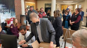 N.H. Secretary of State Dave Scanlan unpacks ballots after a judge allowed a recount in a Manchester House race to continue, Nov. 22, 2022.