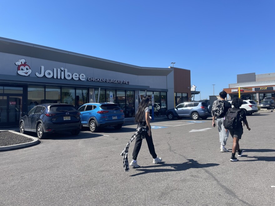 Canvassers with the Asian and Pacific Islander Political Alliance depart from the Jollibee parking lot in Philadelphia on Oct. 5. This Filipino fast food chain has expanded in the United States, reflecting the growing Asian American population.