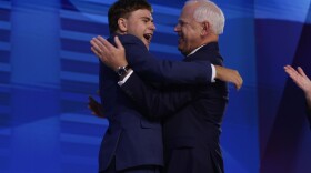 Tim Walz celebrates with his son Gus Walz at the Democratic National Convention.