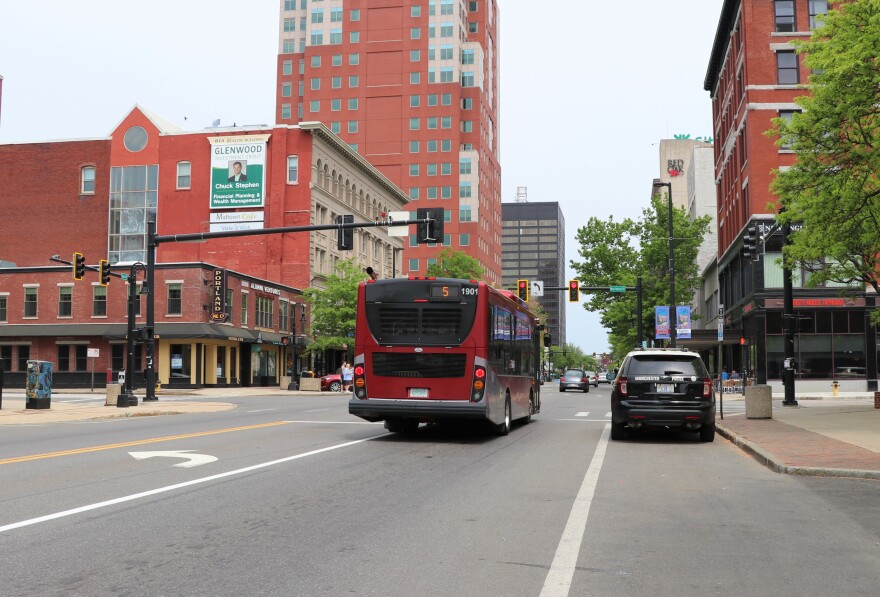 A bus sits in the middle of Elm Street in Manchester, New Hampshire.