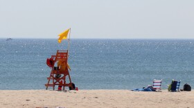 A lifeguard chair on the beach on a sunny day