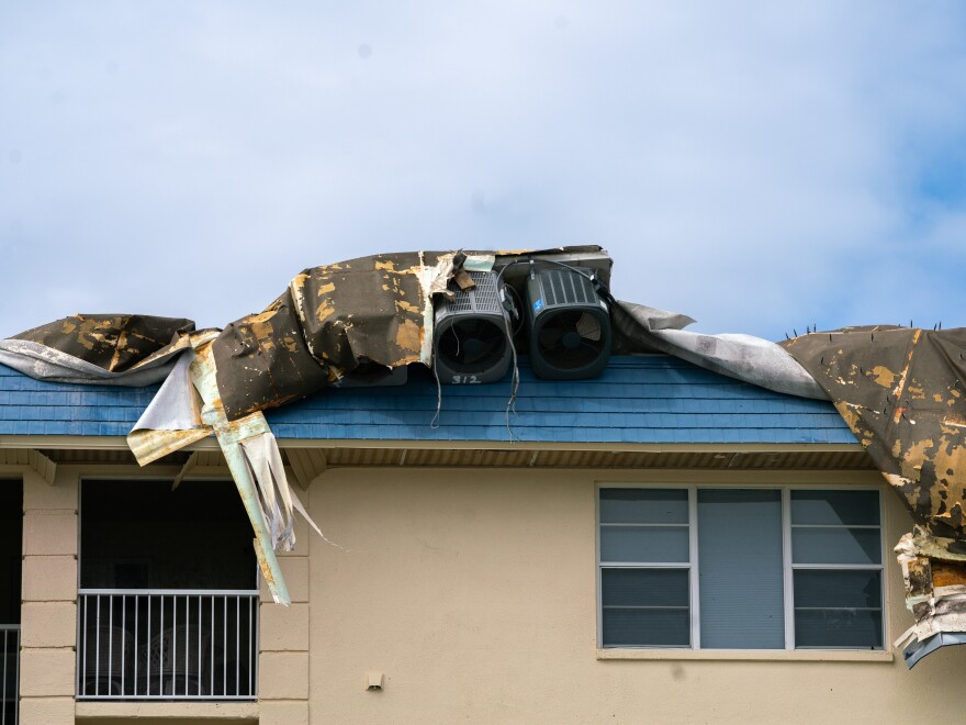 Signs of the damage caused by Hurricanes Helene and Milton are visible through Longboat Key.