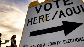 Voters walk to a polling station in Tempe, Ariz., in November 2020.