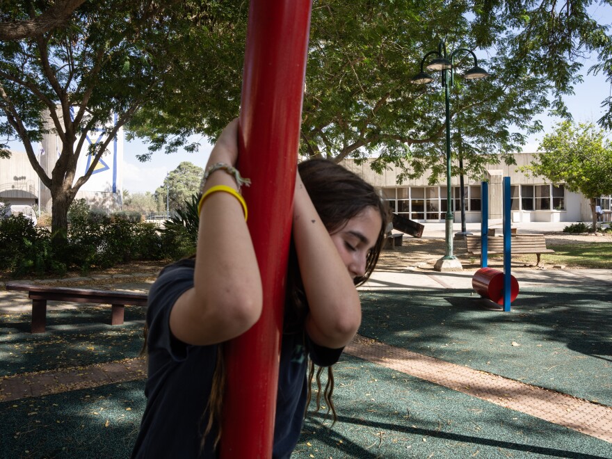 A 13-year-old kibbutz member plays with her friends at a park in Kibbutz Be’eri on Sept. 23. After the survivors of the Oct. 7 attack were evacuated from the kibbutz, about 200 people have returned to live there.