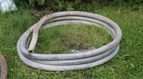 A photo showing a coil of metal piping