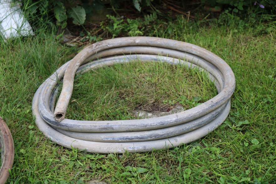 A photo showing a coil of metal piping