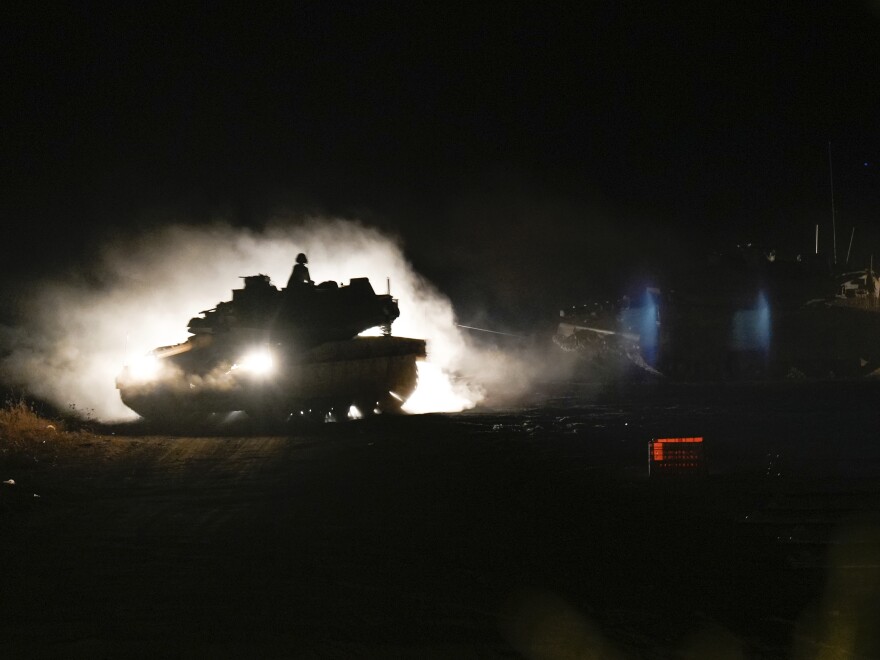 An Israeli tank maneuvers in northern Israel near the Israel-Lebanon border, Monday.