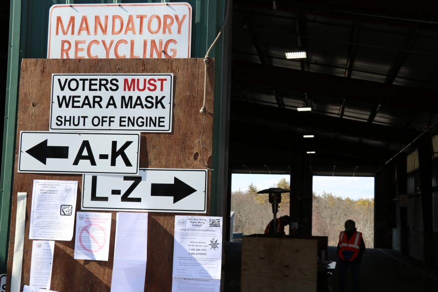 Signs outside the Lee transfer station during the 2021 town election instruct voters to wear their masks and shut off their engines.