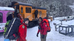 In this image provided by New Hampshire Fish and Game, New Hampshire Fish and Game conservation officer Levi Frye, left, and Jeremy Broughton, from Androscoggin Valley Search and Rescue, prepare to head out on a rescue mission at the Cog Railway base station, Saturday, Feb. 17, 2024, in Mount Washington, N.H. A team of rescuers used the Cog Railway to shave off time but it still took more than 10 hours to save a hiker in conditions that included sustained winds topping 90 mph (145 kph) on New Hampshire's Mount Washington, officials said. (Sgt. Glen Lucas/New Hampshire Fish and Game via AP)