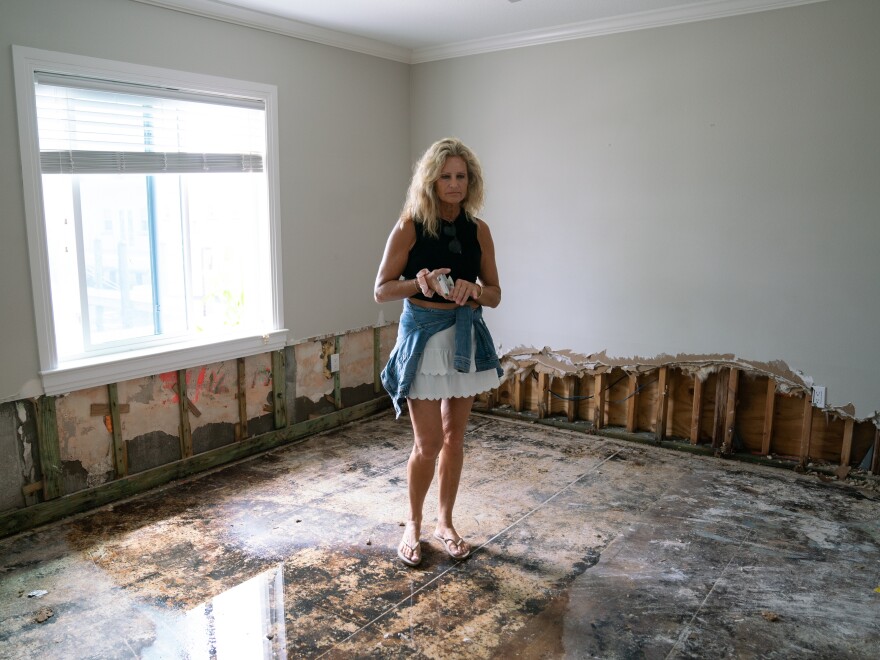 “It was like a little tsunami just came flooding in, and that's where all this damage is from,” Austine said pointing to her torn up walls and floors while describing her experience during Helene.