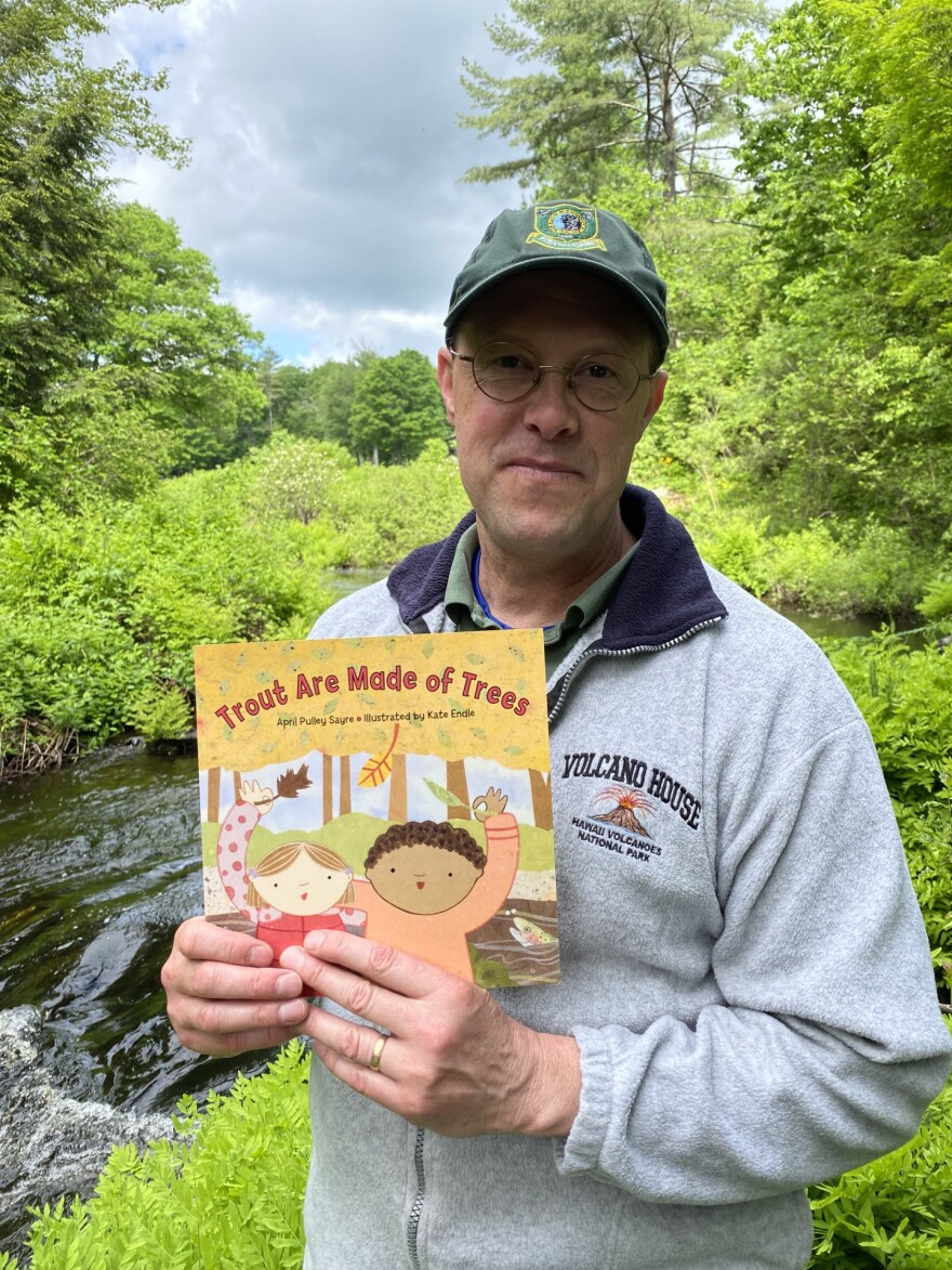 A man holding a book