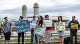 Everett Councilor Stephanie Martins speaks with residents and local climate activists near the Everett marine Terminal.