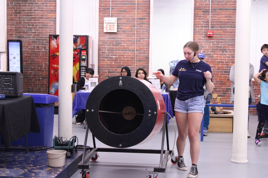 Julia Levreault from the SEE Science Center in Manchester demonstrates an air cannon at a celebration of Hispanic Heritage Month on Friday, Oct. 4, 2024.