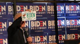 In 2019, Joe Biden held his first New Hampshire campaign event at a restaurant in Hampton, NH. Here he is shown holding up a vanity license plate with his name. Dan Tuohy photo.