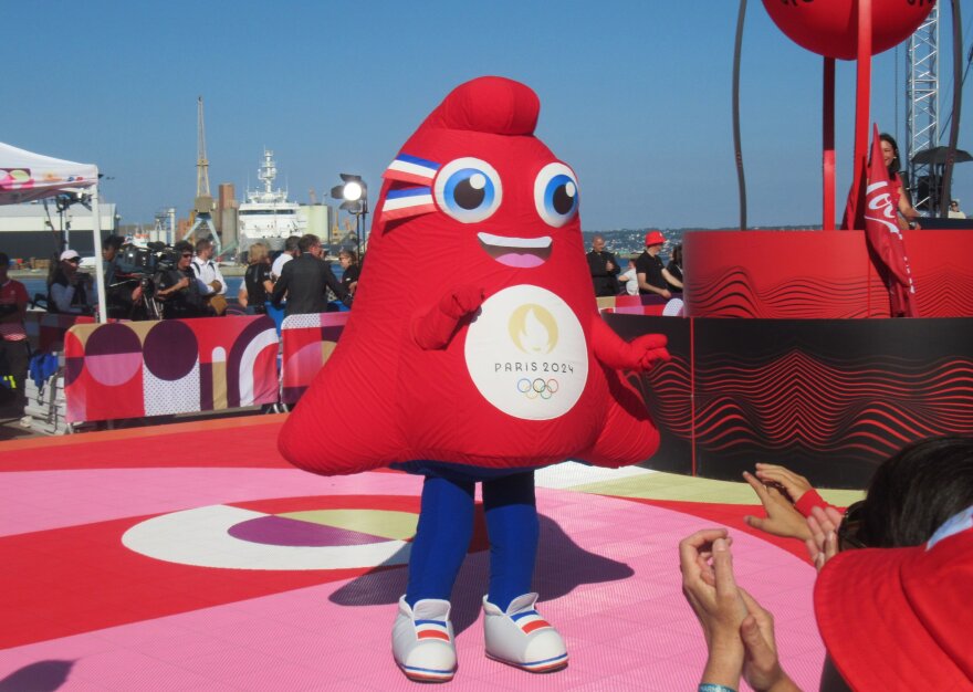 The 2024 Olympic mascot Phryge greets a crowd in Brest, France.