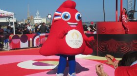 The 2024 Olympic mascot Phryge greets a crowd in Brest, France.