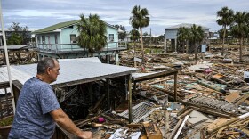 David Hester inspects damages of his house after Hurricane Helene made landfall in Horseshoe Beach, Fla., on Saturday.