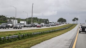 Cars drive east out of Naples, Fla., toward Miami on Tuesday as Hurricane Milton approaches.