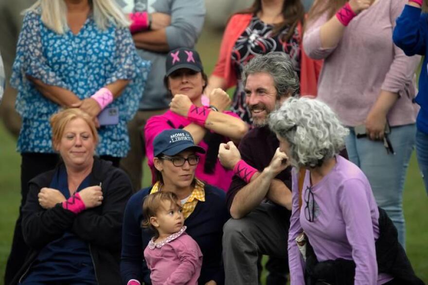 Terese Bastarache (left), joins Jodi Underwood, Rachel Goldsmith, Jeremy Kauffman and Stacey Messina in a display of showing the XX chromosome at the Bow girls’ soccer game on Tuesday, September 24, 2024.