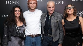 Ronan Day Lewis and his father, Daniel Day-Lewis (left to right in center) are teaming up for a feature film that will bring the decorated actor out of retirement. The pair are seen here as they attended a film screening last year.