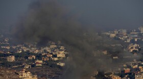 Smoke rises from an Israeli airstrike on Kfar Rouman village, as seen from Marjayoun town, south Lebanon, on Monday.