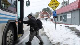 Anthony Crear, of Lebanon, boards a bus outside the emergency homeless shelter under construction on Mechanic Street in Lebanon, N.H., on Tuesday, Jan. 9, 2024. "I'll probably be staying here," said Crear, who is currently living outside. The remodel of the building began on Dec. 6 to create space for 12 shelter beds, two bathrooms with showers, a common area and an office. The shelter opened on Jan. 25, 2024. (Valley News - James M. Patterson) Copyright Valley News. May not be reprinted or used online without permission. Send requests to permission@vnews.com.