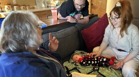 Barb Ibrahim, left, drove half an hour to visit Amber and Matt Luman and their new daughter, Esserley. Ibrahim, a nurse of more than 30 years, is part of new program in Oregon that offers free home visits from a registered nurse for any family with a newborn.