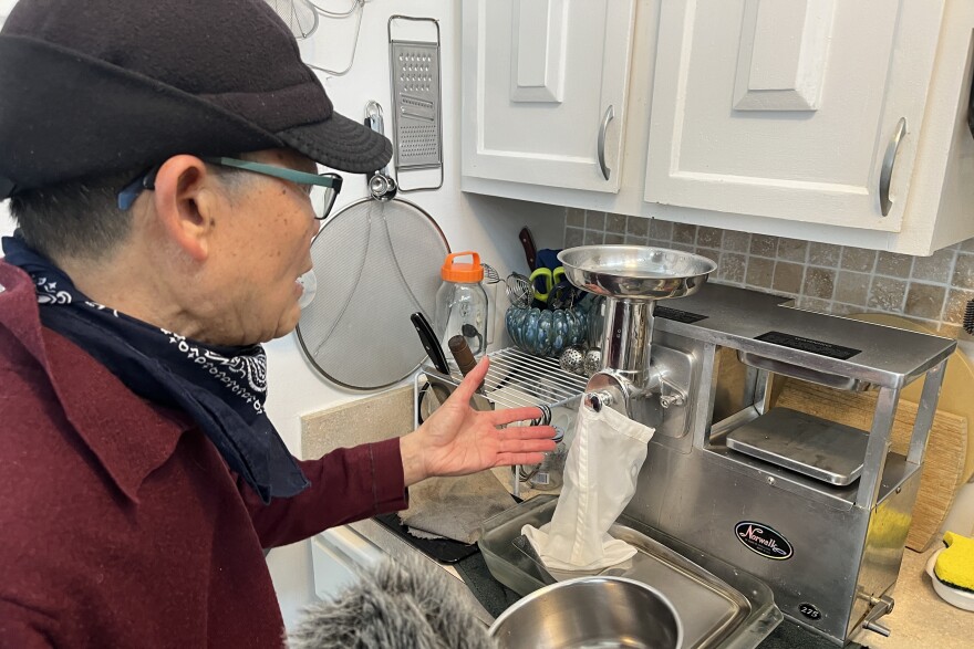 Producer Felix Poon’s dad, Paul, gives a demonstration of his top-of-the-line juicer.