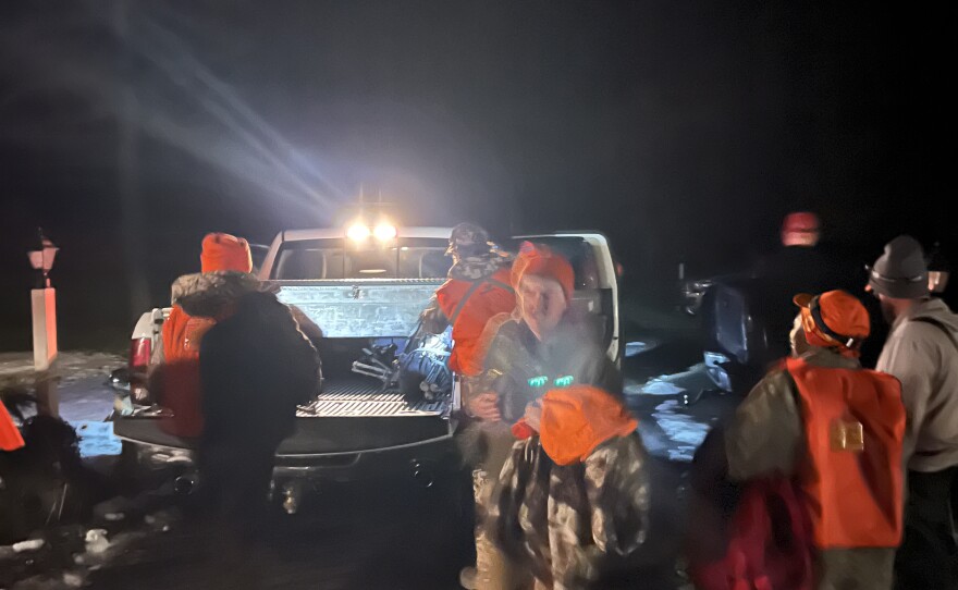 Mentors and mentees load up the trucks before heading out to hunt.