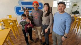 Jeannie Yee-Tong, left, holding granddaughter Tilda Tong, Jeannie's son Corey Tong with wife Natalia, who co-own Eighty Eight Coffee Co. with brother Marc Lee, right. The family has been trying to negotiate a way around the city's intent to take their property by eminent domain.